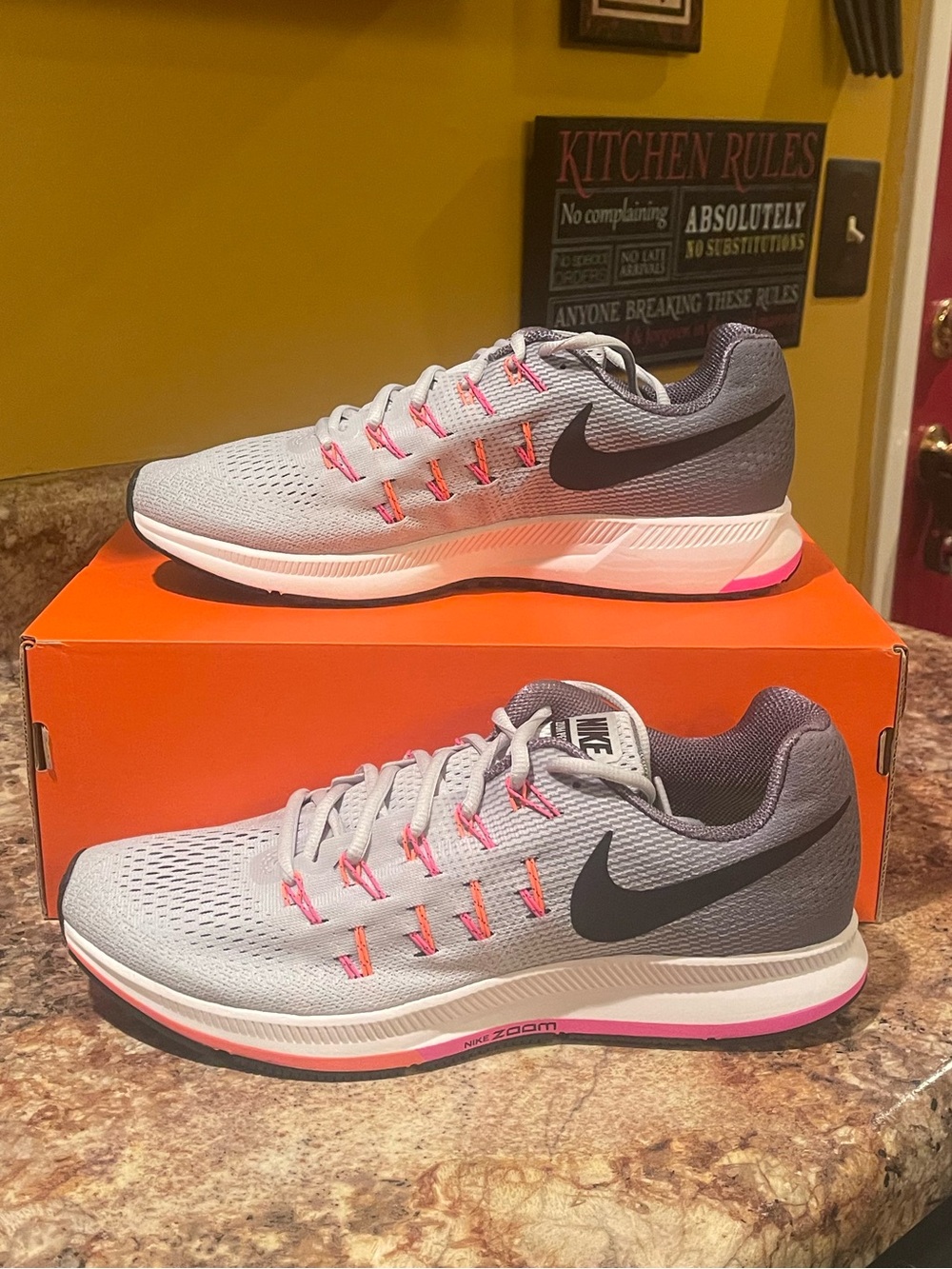 Nike Light Gray Running Sneakers with Pink Eyelet Accents